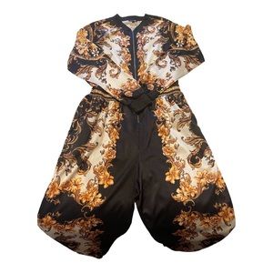 Black and Gold Jumpsuit from FashionNova. Size 1XL.